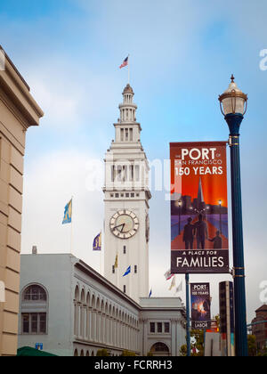 A view of the clock tower of the San Francisco Ferry Building, as seen from the Embarcadero in San Francisco, California. Stock Photo