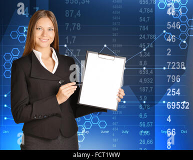 Business woman standing holding a clip board and ballpoint pen Stock Photo