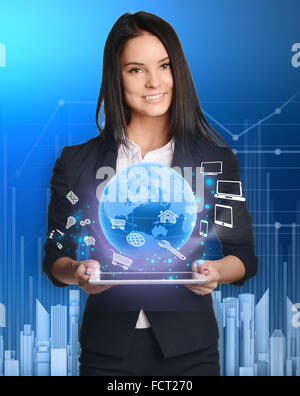 businesswoman with tablet pc against high-tech technology Stock Photo