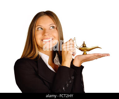 Business woman holding a lamp of Aladdin. Stock Photo