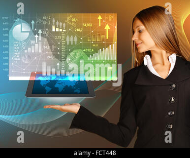 Caucasian appearance girl holding a tablet on hand. Information window with icons and graphics. Stock Photo