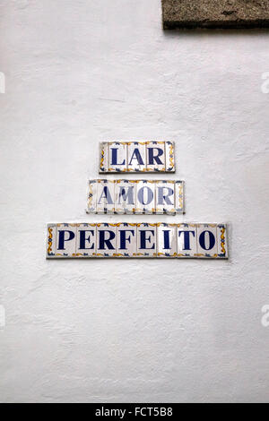 Decorative Street Sign tiles on White Wall reading 'LAR AMORE PERFEITO' in Portuguese ('The Perfect Love'), Porto, Portugal Stock Photo