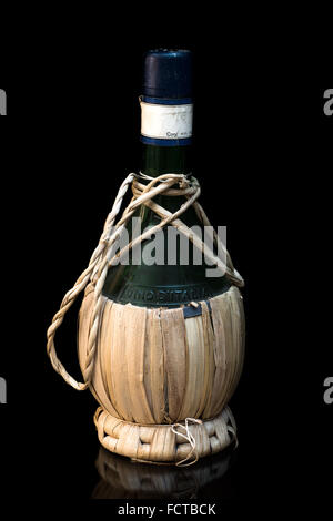 old italian wine bottle on black  Background Stock Photo