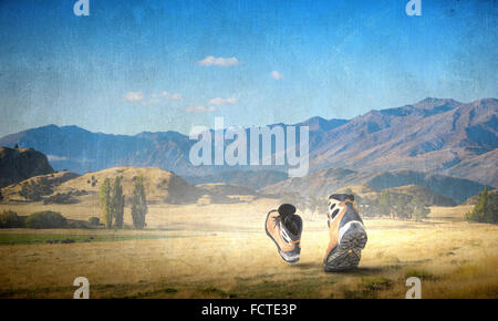 Pair of hikers boots walking on path Stock Photo