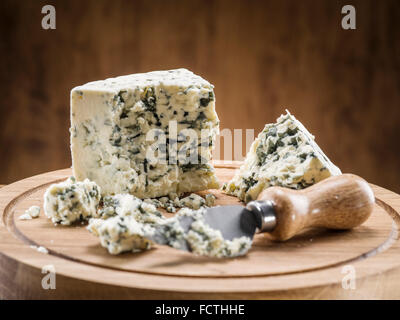 Danish blue cheese on a wooden board. Stock Photo