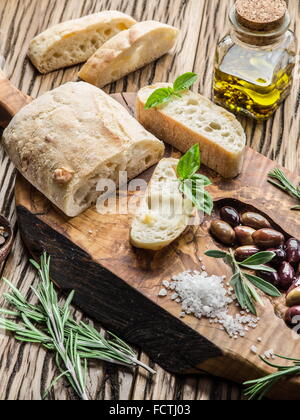 Ciabatta, olives and blue cheese on the wood. Stock Photo
