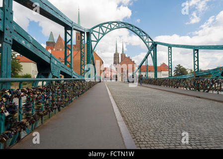 Numerous padlocks on the Tumski Bridge over the Odra river in Wroclaw leading to the Tomski island with the Cathedral Stock Photo