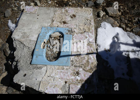 Langtang, Nepal. 25th Jan, 2016. A lavatory is seen covered in rubbles after it was destroyed and buried beneath a landslide on the April 25, 2015 earthquake in Langtang village located in Rasuwa District north of Nepal on Monday, January 25, 16. Langtang is a region located in the Himalayas of Nepal to the north of the Kathmandu Valley and bordering Tibet. Majority of the area of Langtang village is buried beneath a landslide that occurred after the major earthquake that killed more than 9,000 people in Nepal. © Skanda Gautam/ZUMA Wire/Alamy Live News Stock Photo