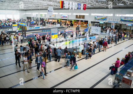 ANTALYA, TURKEY - June 16, 2014: the baggage claim area at the international airport of Antalya in Turkey. It takes nearly 19 million passengers annually Stock Photo