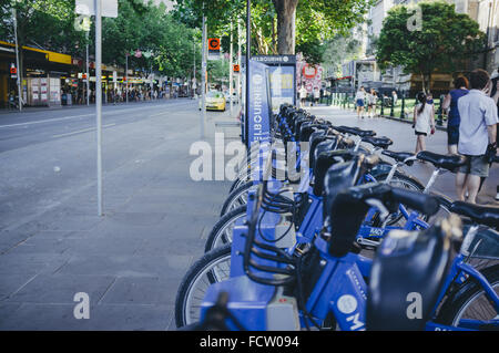 MELBOURNE, AUSTRALIA - DECEMBER 25, 2015: Row of city bicycles on the streets of Melbourne. Image has vintage filter applied Stock Photo