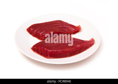 Yellowfin tuna fish steaks (thunnus albacares) isolated on a white studio background. Stock Photo