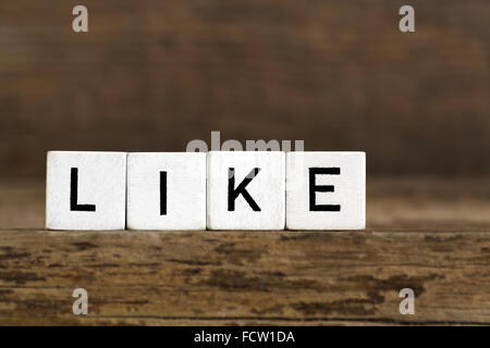 The word like written in cubes on wooden background Stock Photo