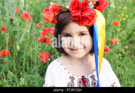 Girl on Meadow in Wreath with Yellow and Blue (Ukrainian Flag Colors) Ribbons Stock Photo