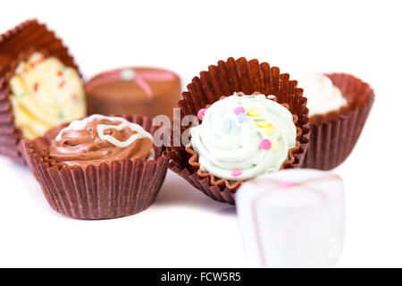 Variety of handmade luxury chocolate pralines isolated on white background  Model Release: No.  Property Release: No. Stock Photo