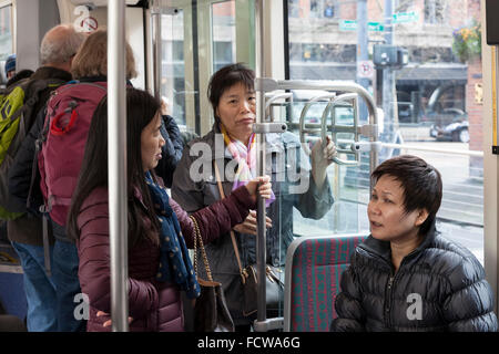 Passengers onboard a streetcar docked at the the Occidental Mall Station on January 24, 2016. Stock Photo