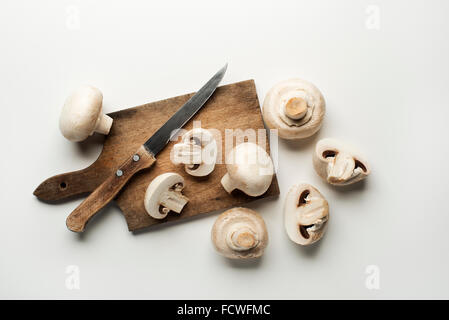 Fresh mushrooms champignons isolated on a white background. Stock Photo
