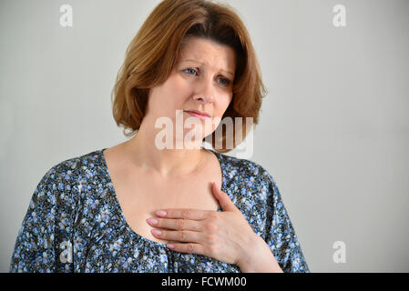 Woman with pain in  chest, angina Stock Photo