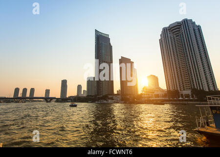 View of the skyscrapers of Bangkok with Chao Phraya river during sunset. Stock Photo