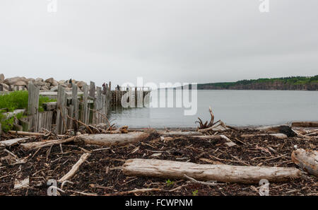 People fishing at the end of a dock in Springtime. Nova Scotia coastline in June. Stock Photo