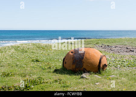 Old rusty sea mine on a beach on the Faroe Islands close to Husavik Stock Photo