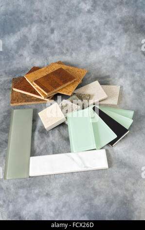 cork flooring glass subway tile for backsplash quartz countertop remnants or samples isolated on gray background Stock Photo