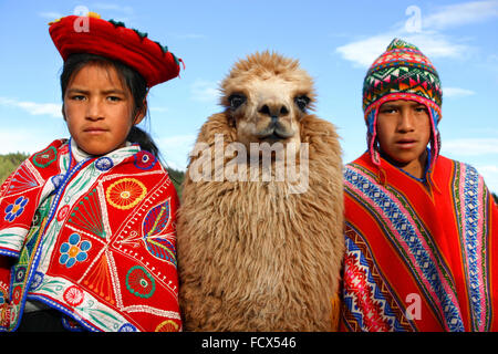 Children of Peru, with their lama, Cuzco Stock Photo