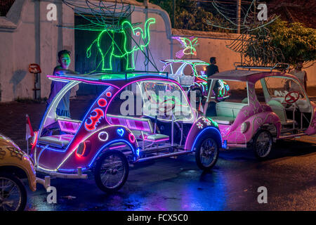 colorful lit bicycle cars on  Alun-Alun square, Yogyakarta, Java, Indonesia, Asia Stock Photo