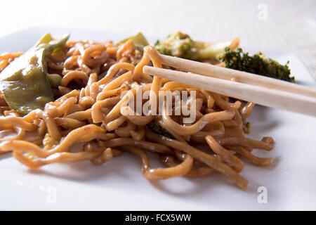 Chinese noodles vegetables and chopsticks Stock Photo