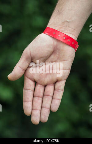 Asylum seekers at Lynx House in Cardiff, South Wales, were made to wear red wrist bands in order to claim food. Stock Photo
