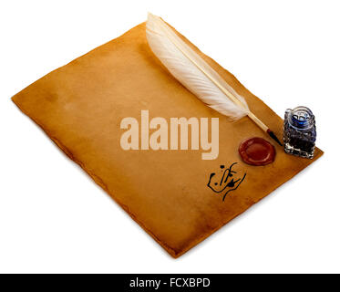 White feather, inkwell, loupe, ancient scroll with red wax seal on an old brown paper sheet close-up isolated. Stock Photo