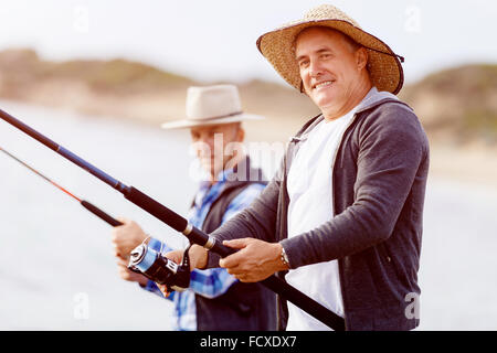 Picture of fishermen fishing with rods Stock Photo