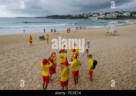 Bondi Beach, Sydney, Australia. 26th Jan, 2016: Australia Day and volunteer Surf Lifesavers sign on for duty at the northern end of Australia's most famous beach. Despite the overcast and stormy weather these Lifesavers can expect to be kept very busy managing and keeping safe the large crowds that will come to the beach on this national holiday. Credit:  Sydney Photographer/Alamy Live News Stock Photo