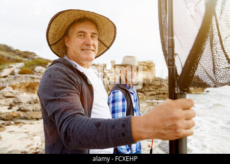 Picture of fishermen fishing with rods Stock Photo