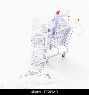 Overflowing receipts in a shopping cart
