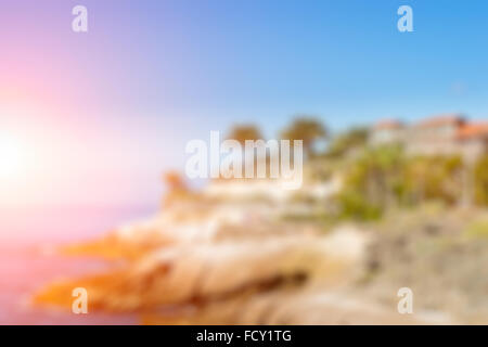 Blurred background with Sunny tropical beach. Tourist abstraction with bokeh. A background substrate for beach travel Stock Photo