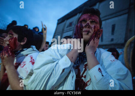 The participants in the carnival of Alsasua smear their faces and bodies with animal blood Stock Photo
