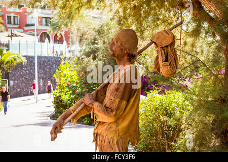 TENERIFE, SPAIN - JANUARY 14, 2013: Street performer-meme depicts a wandering poor man, Plaza Playa del Duque, Costa Adeje Stock Photo