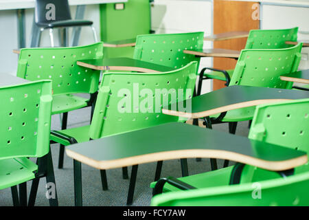 Empty classroom with green charis in a high school Stock Photo