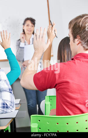 Students know the answer to the teacher's question Stock Photo