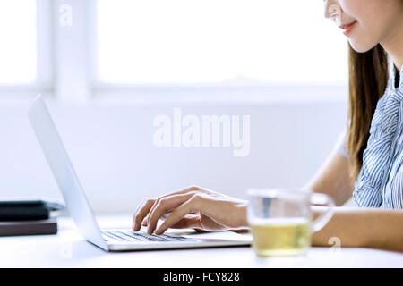 Cropped image of beautiful woman working in office Stock Photo