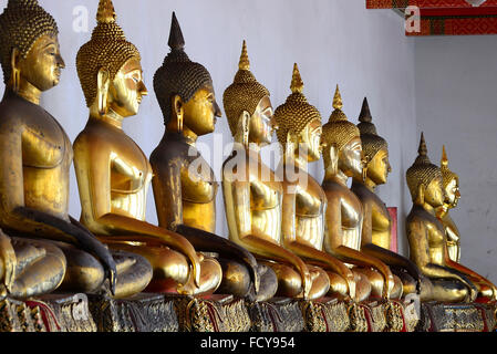 Standing golden Buddha statues. Wat Pho temple, Bangkok, Thailand Stock Photo
