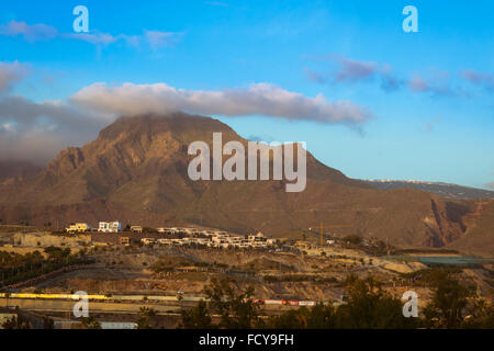 TENERIFE, SPAIN - JANUARY 17, 2013: Sunrise over Teide: a panoramic view of the non-touristic part of the city and El Teide Stock Photo