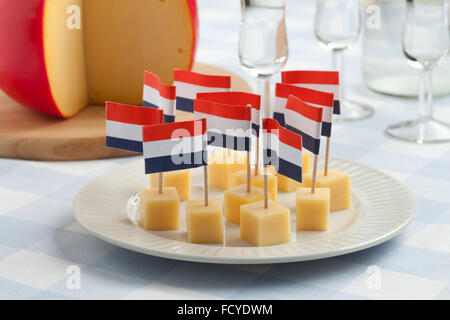 Edam cheese snacks with flags and Dutch gin Stock Photo