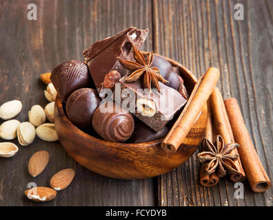 Chocolate pralines with pistachio,almonds,cinnamon stick and anise Stock Photo