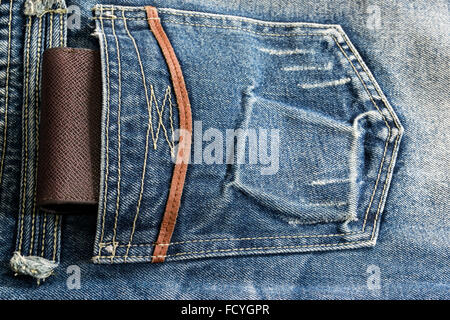Brown leather wallet in a pocket jeans. Stock Photo