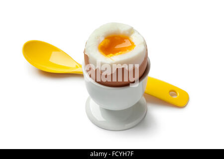 Soft boiled egg in an egg cup on white background Stock Photo