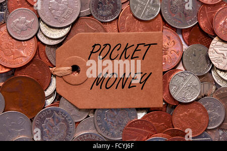 Pocket money label on British mixed coins inside a glass jar concept ...
