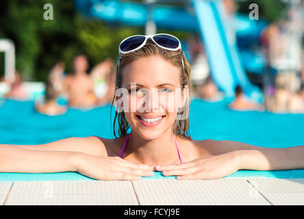 Beautiful young woman in the swimming pool Stock Photo