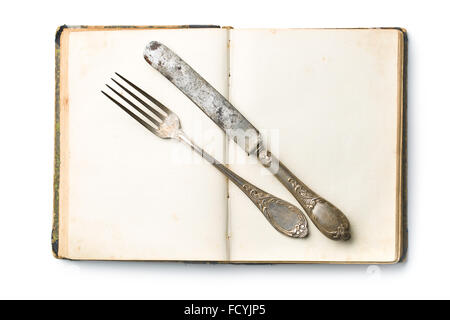 vintage book and cutlery on white background Stock Photo