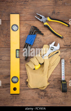 High angle of various tools for remodeling on wood background Stock Photo